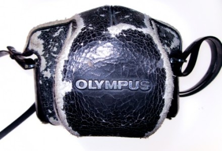 Gunnie's well worn camera case, scuffed around the edges.