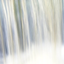 In this abstract image it feels like water cascading fast perhaps a waterfall, wet and white at the bottom where the air become so moist that colours appear.